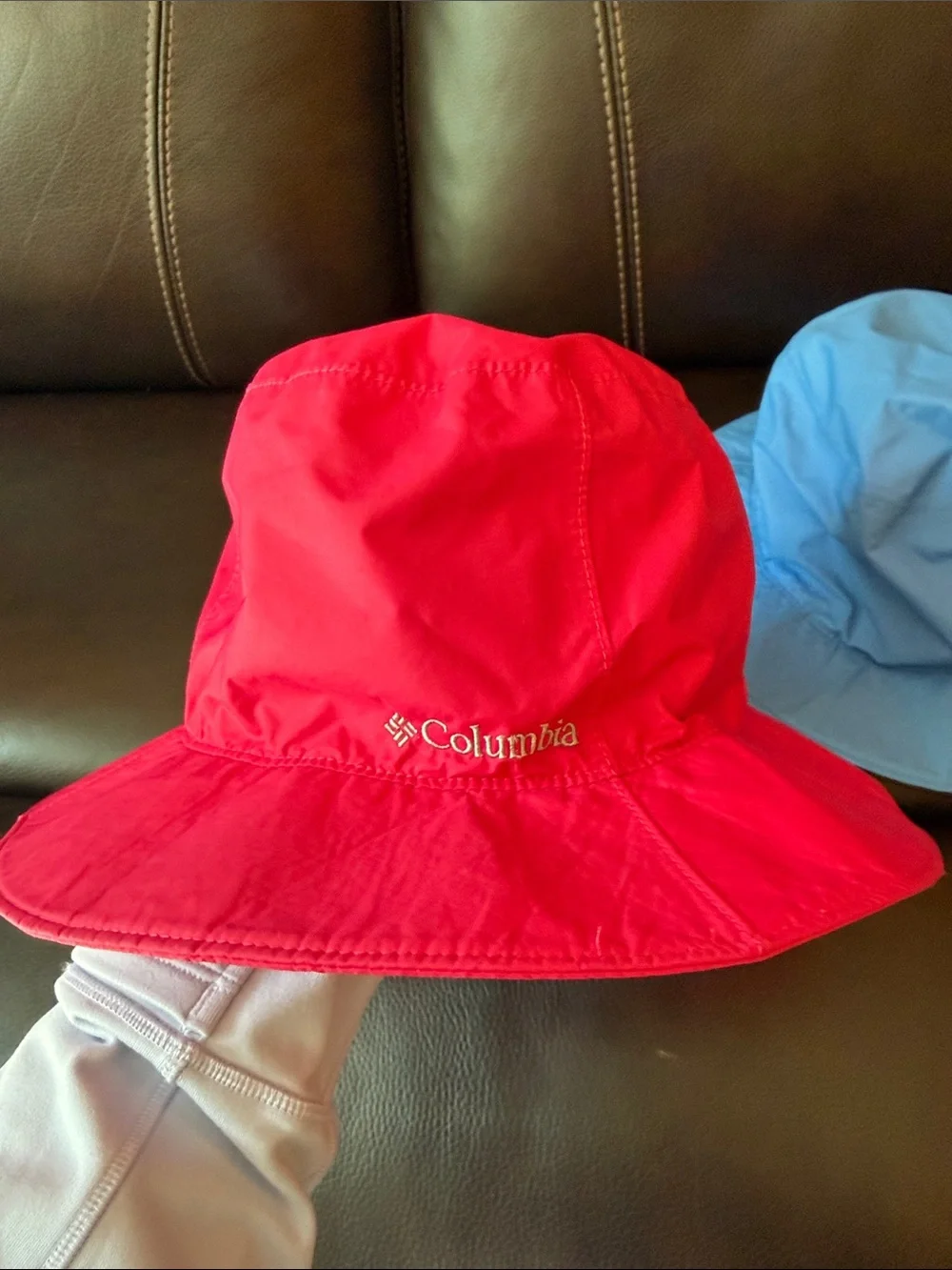 2 Columbia Kids Bucket Hats in Red and Light Blue.